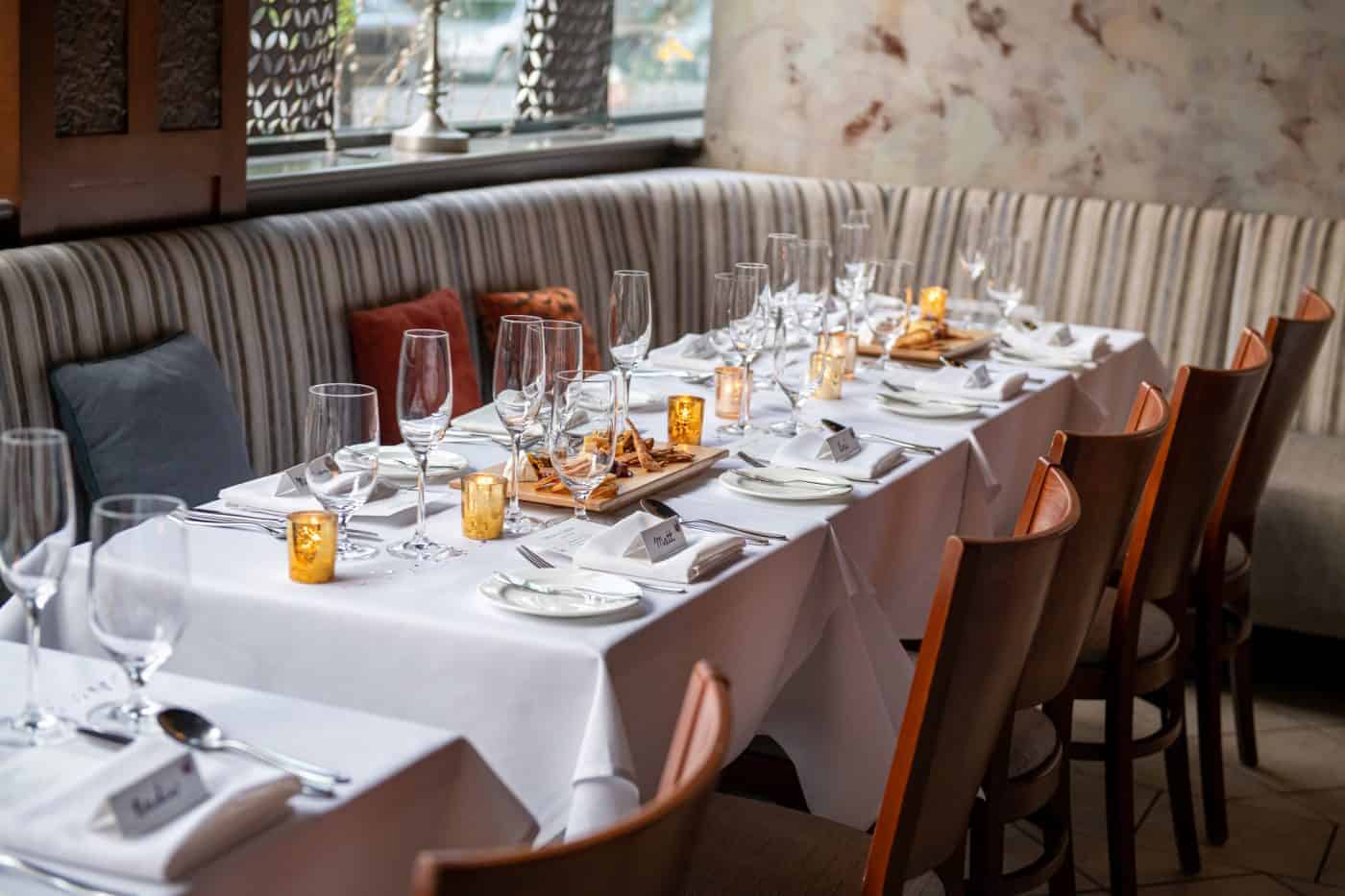 Elegant dining setup for 16 guests in Providence lounge