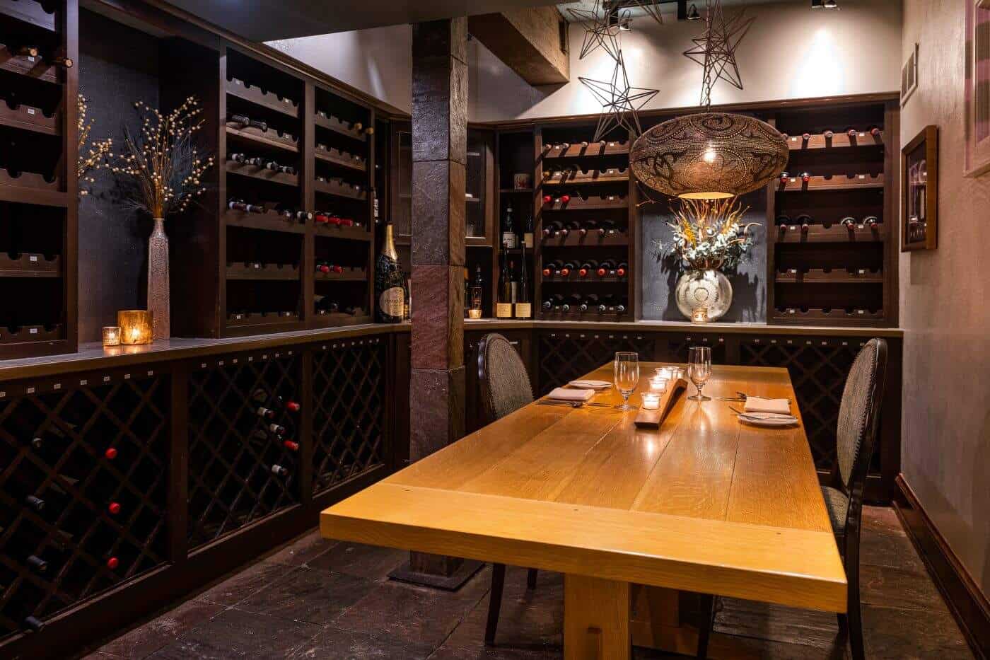 Intimate dining setup for 8 guests in Providence wine room