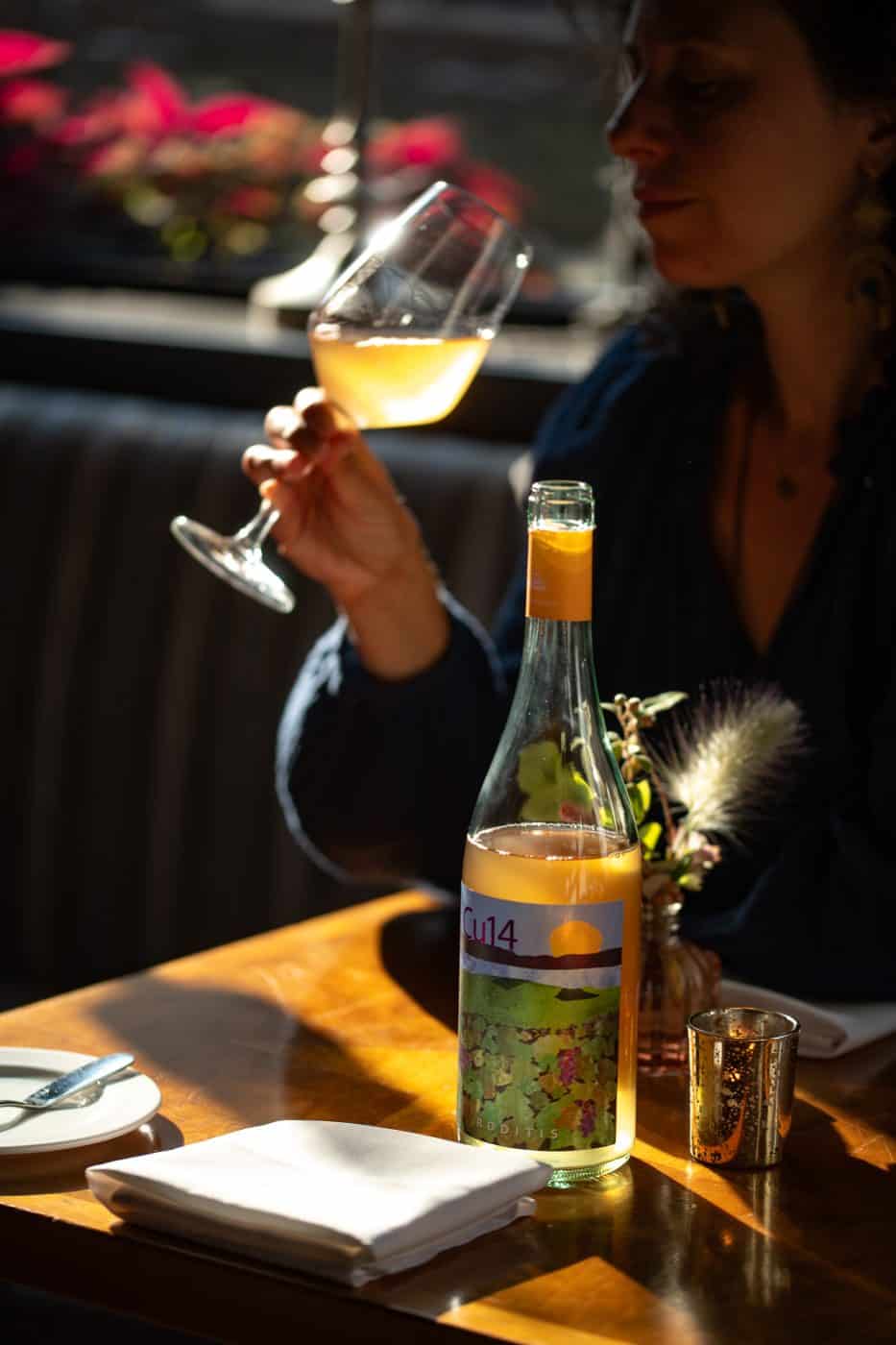 Sommelier selecting wine for private event and wine dinner in Providence